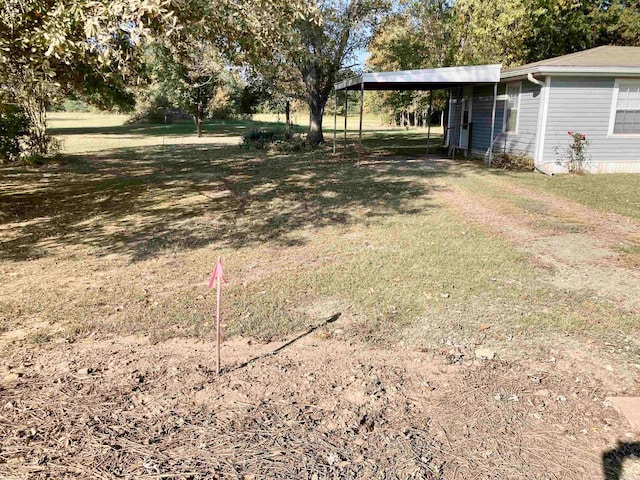 view of yard featuring a carport