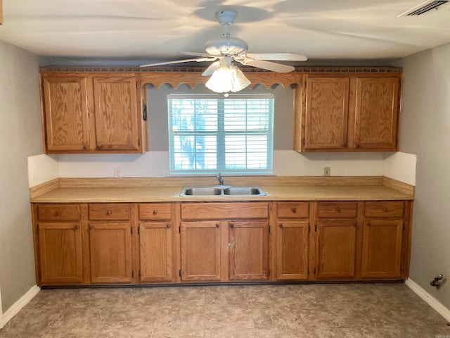 kitchen featuring sink and ceiling fan