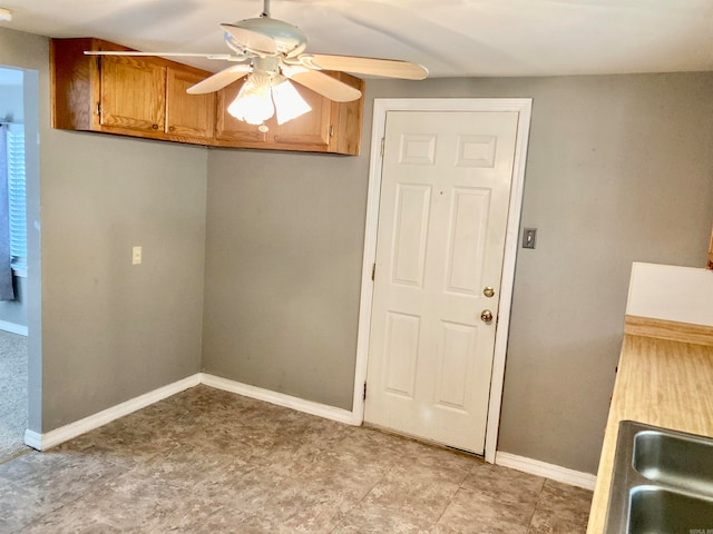 interior space featuring ceiling fan