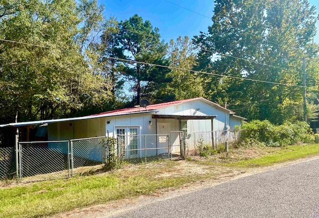 view of property exterior with a carport