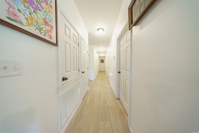 hall with light wood-type flooring