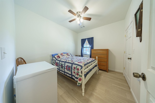 10 Strawberry Valley Rd, Ash Flat, AR 72513 - bedroom with visible vents, light wood finished floors, baseboards, and a ceiling fan