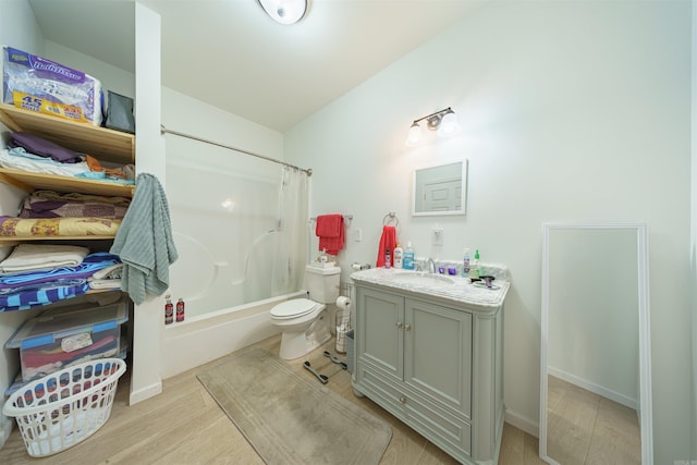 full bathroom with shower / bath combination with curtain, vanity, hardwood / wood-style floors, and toilet