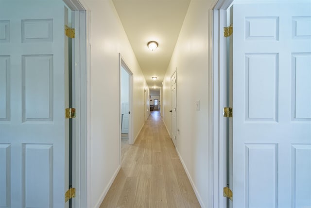 hallway featuring light hardwood / wood-style flooring