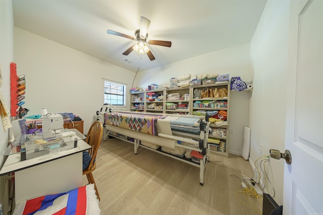 bedroom featuring light wood-type flooring and ceiling fan