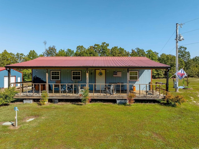10 Strawberry Valley Rd, Ash Flat, AR 72513 - view of front of home with covered porch, a front lawn, and metal roof