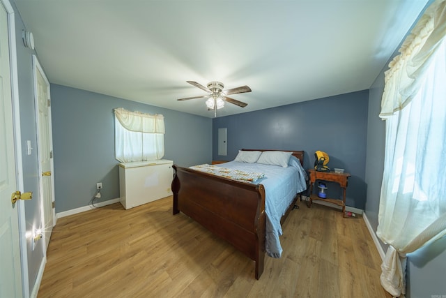 bedroom featuring light hardwood / wood-style floors and ceiling fan