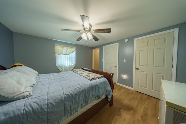 bedroom with ceiling fan and wood-type flooring