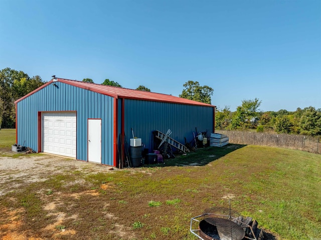 garage featuring a lawn