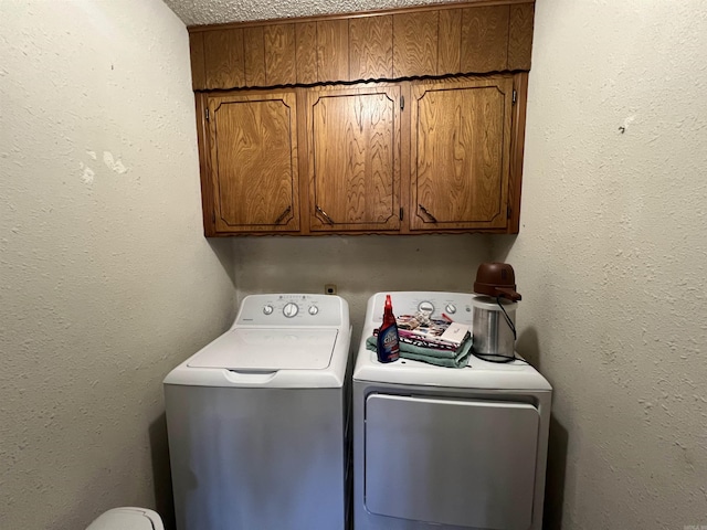 laundry area with cabinets and independent washer and dryer