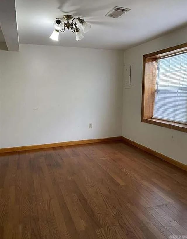 spare room with hardwood / wood-style flooring