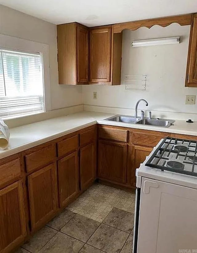 kitchen with sink and white range oven