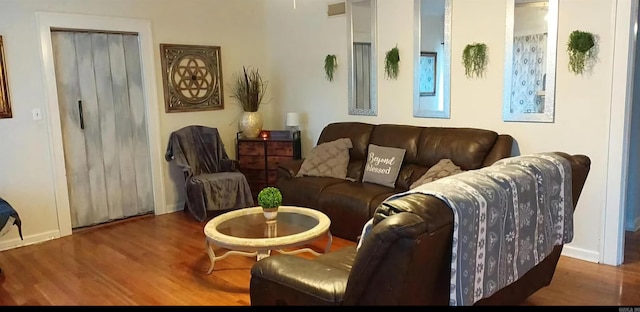 living room with dark wood-type flooring