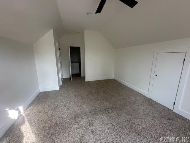 bonus room featuring carpet flooring, vaulted ceiling, and ceiling fan