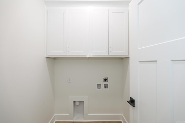 washroom with electric dryer hookup, hookup for a washing machine, and cabinets