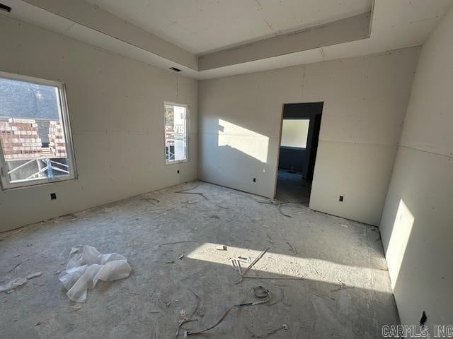 empty room featuring a tray ceiling