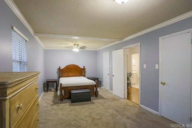 carpeted bedroom with ornamental molding, a textured ceiling, and ceiling fan