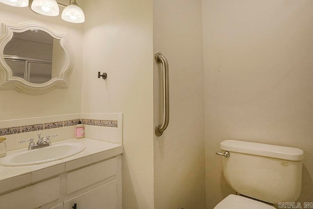 bathroom with vanity and toilet