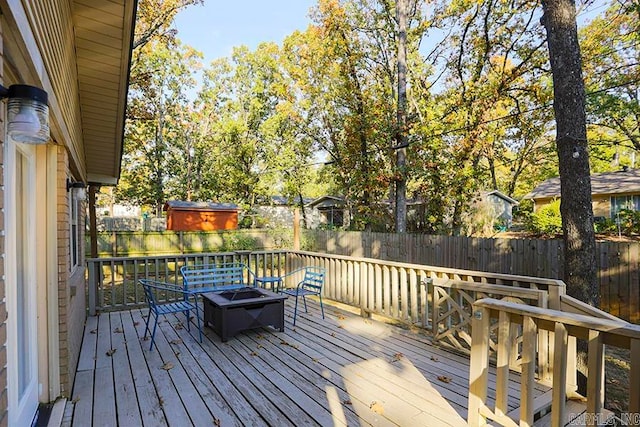 deck with an outdoor fire pit