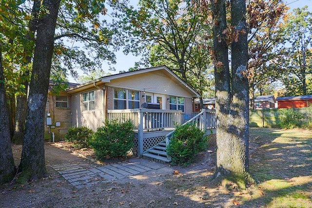 view of front of property with a wooden deck