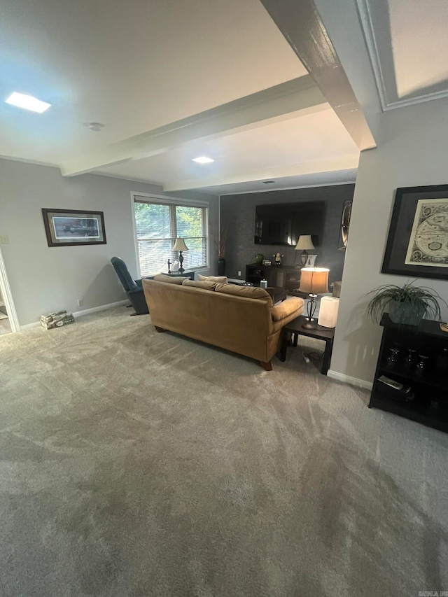 carpeted living room with beam ceiling