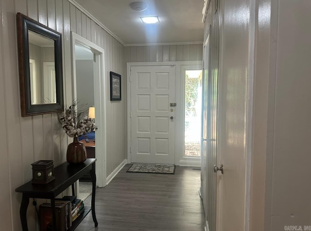 doorway to outside featuring ornamental molding and wood-type flooring