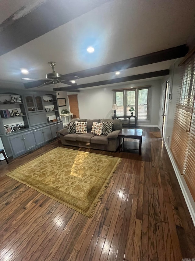 living room with ceiling fan and dark hardwood / wood-style flooring