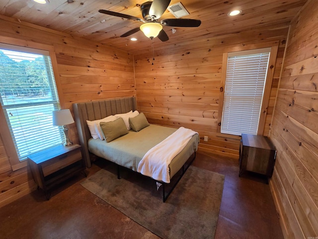 bedroom with wood ceiling, wooden walls, and ceiling fan