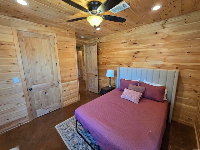 bedroom with ceiling fan, wood walls, and wooden ceiling