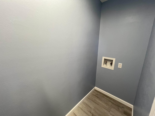 laundry room featuring washer hookup and hardwood / wood-style flooring