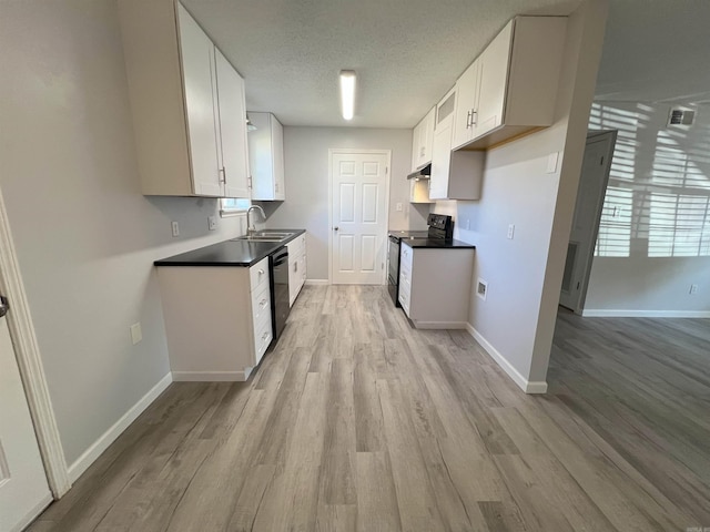 kitchen with white cabinets, sink, a textured ceiling, black appliances, and light wood-type flooring