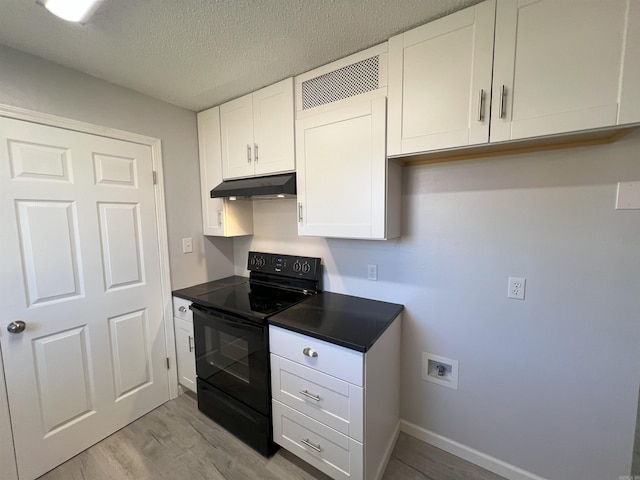 kitchen with light hardwood / wood-style flooring, black electric range, a textured ceiling, and white cabinetry