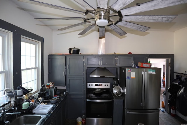 kitchen featuring gray cabinets, sink, stainless steel fridge, and ventilation hood