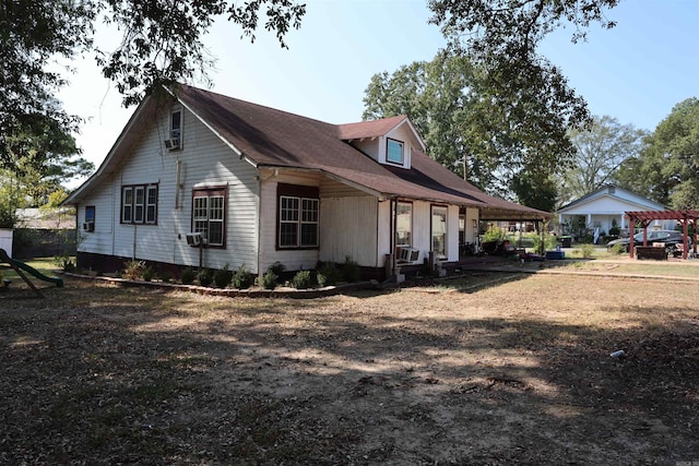 view of side of property featuring cooling unit and a carport