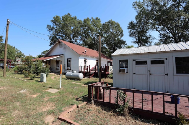 view of yard with a deck and a storage unit