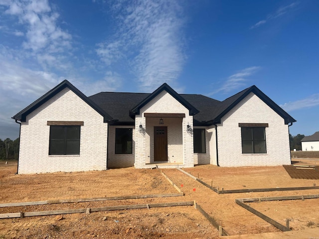 view of front of house featuring brick siding