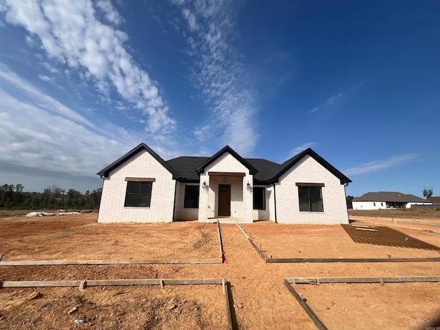 view of front of house with brick siding