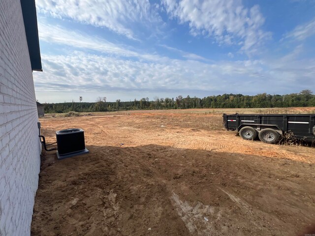 view of yard with a rural view