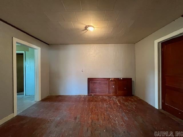 unfurnished room featuring hardwood / wood-style flooring