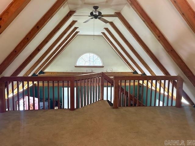 bonus room with ceiling fan, beam ceiling, and high vaulted ceiling