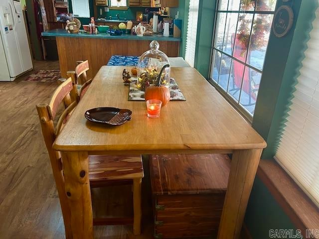 dining room with dark hardwood / wood-style flooring