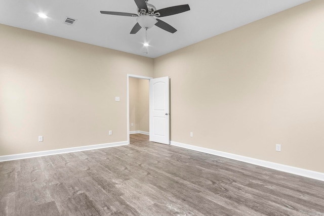 empty room featuring ceiling fan and wood-type flooring