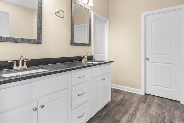 bathroom with vanity and hardwood / wood-style flooring