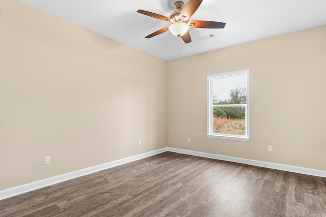 empty room with ceiling fan and hardwood / wood-style floors