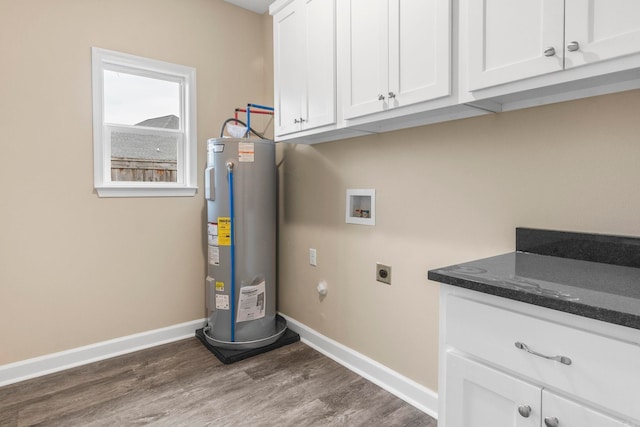 washroom featuring hookup for an electric dryer, washer hookup, dark hardwood / wood-style flooring, and water heater