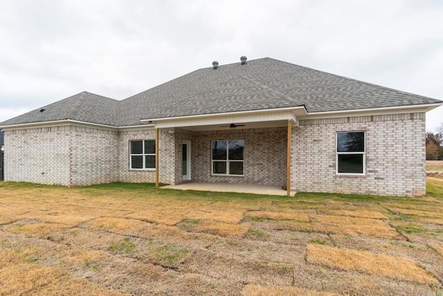 back of house with a yard, a patio, and ceiling fan