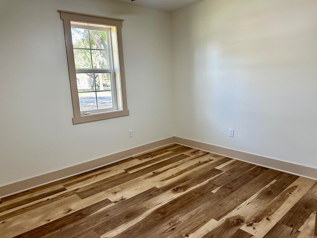 spare room with hardwood / wood-style flooring