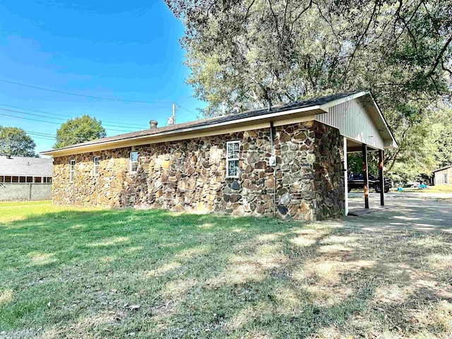 view of property exterior featuring a lawn