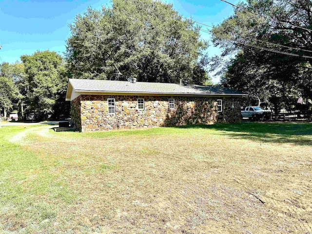 view of property exterior with a yard