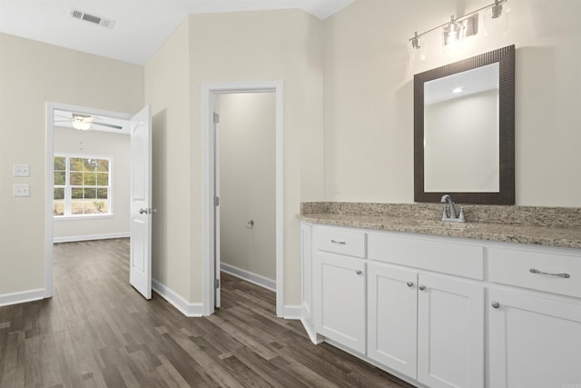 bathroom with ceiling fan, vanity, and hardwood / wood-style flooring